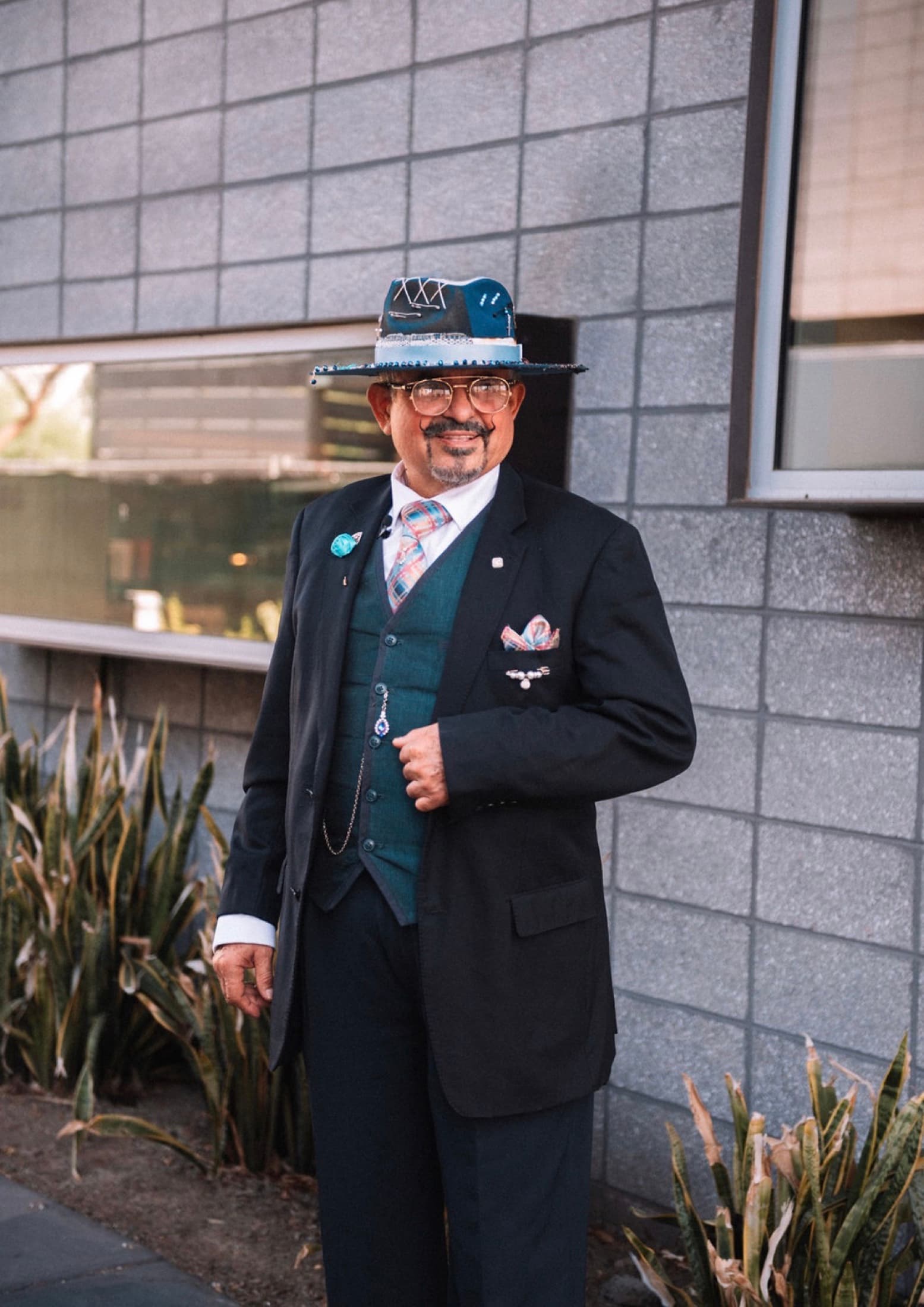 Artist Jessy Delgado wearing one of his handmade hats